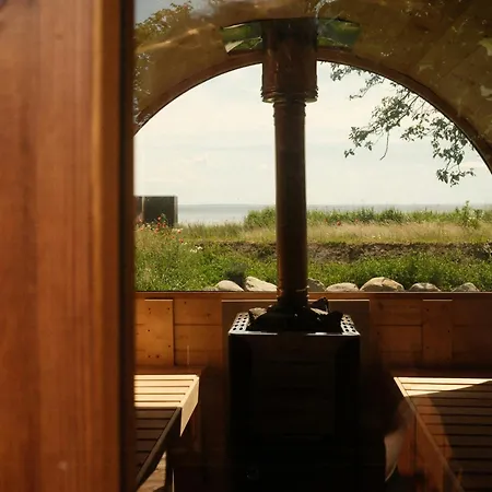 Thatched House On The Waterfront In