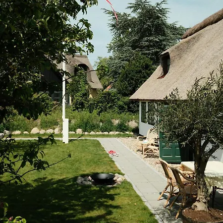 Thatched House On The Waterfront In *